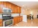 Bright kitchen open to dining area, featuring stainless steel appliances and ample counter space at 127 Long Shadow Pl, Durham, NC 27713
