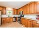 Spacious kitchen with wood cabinets, stainless steel appliances, and granite countertops at 127 Long Shadow Pl, Durham, NC 27713