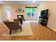 Inviting living room with comfortable seating, a fireplace, and natural light from the windows at 127 Long Shadow Pl, Durham, NC 27713