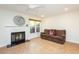 Cozy living room with fireplace, ceiling fan and comfortable sofa, ideal for relaxing at 127 Long Shadow Pl, Durham, NC 27713
