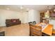 Comfortable living room adjacent to dining area featuring a ceiling fan and access to the kitchen at 127 Long Shadow Pl, Durham, NC 27713