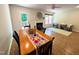 Open-concept living room with a ceiling fan, fireplace, outdoor access, and access to seating area at 127 Long Shadow Pl, Durham, NC 27713