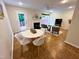 Open-concept living area with a fireplace, seating, and access to an outdoor deck through a glass door at 127 Long Shadow Pl, Durham, NC 27713