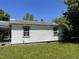 Rear exterior showcasing the home's siding, roof, and window details, surrounded by a natural landscape at 1311 Branch St, Rocky Mount, NC 27801