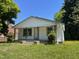 Charming home with a cozy front porch, a classic facade, and a lawn with flowering weeds at 1311 Branch St, Rocky Mount, NC 27801