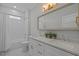 A classic bathroom with a double vanity, shower, and tiled floor at 1312 Lancaster St, Durham, NC 27701