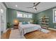 Stylish bedroom featuring hardwood floors, a ceiling fan, and a ladder shelf at 1312 Lancaster St, Durham, NC 27701