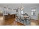 Bright dining area with modern chandelier and views of the backyard at 1312 Lancaster St, Durham, NC 27701