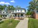Charming two-story home featuring a welcoming front porch, complemented by a well-manicured lawn and a concrete driveway at 1312 Lancaster St, Durham, NC 27701