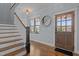 Welcoming foyer with hardwood floors, staircase, and natural light from the front door at 1312 Lancaster St, Durham, NC 27701