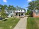 A charming craftsman-style home featuring a well-manicured lawn and a welcoming front porch with a classic design at 1312 Lancaster St, Durham, NC 27701