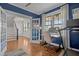 Bright home office featuring a desk, hardwood floors, and view into the entryway at 1312 Lancaster St, Durham, NC 27701