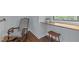 Cozy nook with a rocking chair and a built-in wooden desk at 1312 Lancaster St, Durham, NC 27701