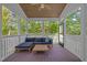 Relaxing screened-in porch with comfortable seating and wooded views at 1312 Lancaster St, Durham, NC 27701