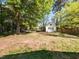 Spacious backyard with plenty of room to roam with a shed and playground at 1317 Kelly Rd, Garner, NC 27529