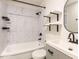 Modern bathroom with tiled shower/tub and sleek vanity with matte black hardware at 1317 Kelly Rd, Garner, NC 27529
