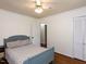 Cozy bedroom with hardwood floors, a ceiling fan, and closet space at 1317 Kelly Rd, Garner, NC 27529