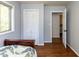 Neutral bedroom featuring hardwood floors, closet and connecting room at 1317 Kelly Rd, Garner, NC 27529