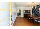 Elegant dining room with hardwood floors, stylish wallpaper, and a chandelier at 1317 Kelly Rd, Garner, NC 27529