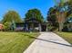 Inviting single-story home with a spacious driveway and a well-maintained lawn at 1317 Kelly Rd, Garner, NC 27529
