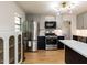 Well-equipped kitchen featuring stainless steel appliances, an island, and modern finishes at 1317 Kelly Rd, Garner, NC 27529