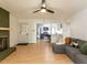 Cozy living room featuring a fireplace, hardwood floors, and open access to the kitchen at 1317 Kelly Rd, Garner, NC 27529
