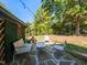 Relaxing backyard patio with stone floor, outdoor seating and string lights at 1317 Kelly Rd, Garner, NC 27529
