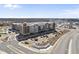 Stunning aerial view of a well-maintained apartment complex with ample parking and beautiful landscaping at 1335 Herb Garden Way, Apex, NC 27502