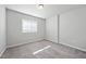 Bright, carpeted bedroom with neutral walls and a window for natural light at 1335 Herb Garden Way, Apex, NC 27502