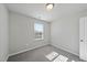 A well lit bedroom with carpet and a window is move in ready at 1335 Herb Garden Way, Apex, NC 27502