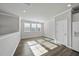 Bright dining room featuring hardwood floors, large windows, and neutral paint at 1335 Herb Garden Way, Apex, NC 27502