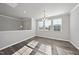 Bright dining room featuring hardwood floors, large windows, and neutral paint at 1335 Herb Garden Way, Apex, NC 27502