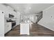 Modern kitchen with stainless steel appliances, quartz countertops, and kitchen island at 1335 Herb Garden Way, Apex, NC 27502