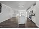 Open concept living space with hardwood floors, natural light, kitchen, and dining area at 1335 Herb Garden Way, Apex, NC 27502