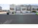 Rear exterior view of townhomes featuring garages and private balconies at 1335 Herb Garden Way, Apex, NC 27502