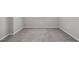 Neutral carpeted room featuring several electrical outlets on the wall at 1335 Herb Garden Way, Apex, NC 27502