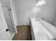 Modern bathroom featuring double sinks, white cabinetry, a large mirror, and a glass-enclosed shower at 136 W Tecoma Ln, Clayton, NC 27520