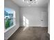 Bedroom featuring neutral walls, plush carpeting, a modern light fixture and ample natural light at 136 W Tecoma Ln, Clayton, NC 27520