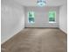 Bright bedroom with natural light, carpet and ample space at 136 W Tecoma Ln, Clayton, NC 27520