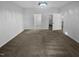 Spacious bedroom featuring plush carpeting, a modern light fixture, and an en-suite bathroom at 136 W Tecoma Ln, Clayton, NC 27520