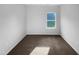 Bright bedroom featuring neutral walls, plush carpeting and a window providing natural light at 136 W Tecoma Ln, Clayton, NC 27520