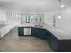 Modern kitchen featuring stainless steel appliances, granite countertops, and an open concept layout at 136 W Tecoma Ln, Clayton, NC 27520