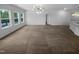 Spacious living room with ample natural light and neutral carpet at 136 W Tecoma Ln, Clayton, NC 27520