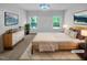 Cozy main bedroom with carpet, bright windows, and modern decor at 136 W Tecoma Ln, Clayton, NC 27520