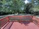 Backyard deck offering a great space for outdoor enjoyment in a nature-filled backyard at 1405 Cross Link Rd, Raleigh, NC 27610