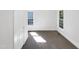 Bright bedroom with neutral walls and carpet featuring two large windows at 1405 Cross Link Rd, Raleigh, NC 27610