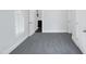 Bright bedroom with fresh paint, new carpeting, and attached bath with updated sink and vanity at 1405 Cross Link Rd, Raleigh, NC 27610