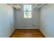 Walk-in closet with shelving and a window for natural light at 1408 Edgebrook Dr, Garner, NC 27529