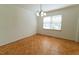 Empty dining room featuring parquet floors, white walls, and a chandelier at 1408 Edgebrook Dr, Garner, NC 27529