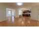 Open-concept living space flowing into the kitchen area, with hardwood floors at 1408 Edgebrook Dr, Garner, NC 27529
